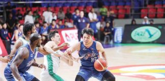 Meralco Bolts’ Kier John Quinto tries to ward off the defense of Terrafirma Dyip’s Andreas Cahilig. PBA PHOTO