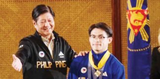 President Ferdinand Marcos, Jr. confers the Presidential Medal of Merit to Filipino gymnast Carlos Edriel Yulo, who captured two gold medals in the 2024 Paris Olympics. PHOTO COURTESY OF PPA POOL