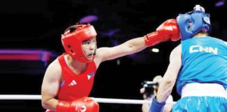 Filipina boxer Nesthy Petecio lands a solid right straight to the face of China’s Zichun Xu. REUTERS