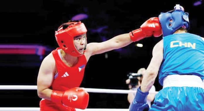 sports_Petecio_resized Filipina boxer Nesthy Petecio lands a solid right straight to the face of China’s Zichun Xu. REUTERS