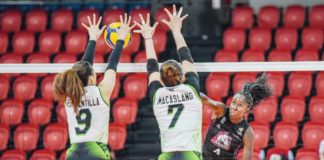 Akari Power Chargers’ Oly Okaro attempts to score against two NxLed Chameleons’ defenders. PVL PHOTO