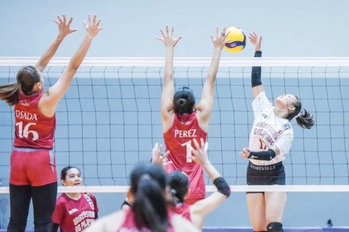 sports_UP_resized Negrense Jothea Ramos of the University of the Philippines Fighting Maroons scores against a Lyceum of the Philippines Lady Pirates' defender. V-LEAGUE PHOTO