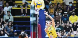Negrense Cassie Carballo of University of Santo Tomas Golden Tigresses drops the ball towards the side of Far Eastern University Lady Tamaraws. V-LEAGUE PHOTO