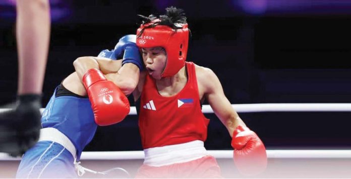 sports_Villegas_resized Filipina boxer Aira Villegas was held on by her opponent, Roumaysa Boualam of Algeria, during their 2024 Paris Olympics encounter. REUTERS