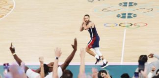 Team USA’s Stephen Curry gestures to the French crowd after hitting a three-pointer during their 2024 Paris Olympics gold medal game against France. JAMIE SQUIRE/GETTY IMAGES
