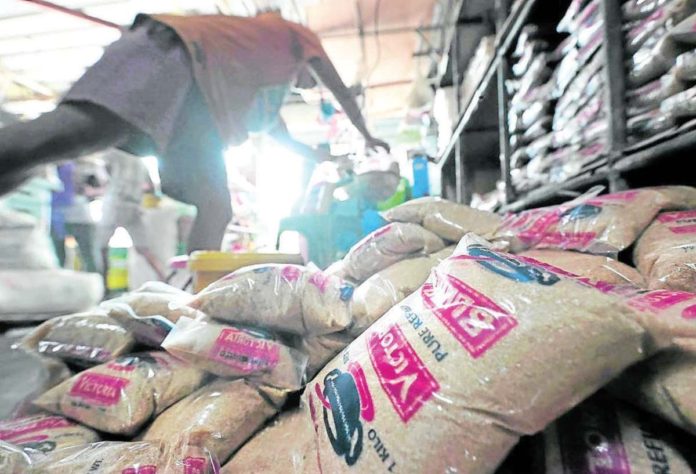 A worker repacks sugar at the Visayas Avenue public market. The Philippines may allocate all its sugar for domestic consumption as local production remains insufficient to meet the demand. GRIG C. MONTEGRANDE/INQUIRER.NET PHOTO