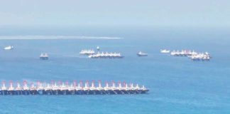 This handout photo taken on December 2, 2023 and released by the Philippine Coast Guard shows an aerial view of Chinese vessels gathered by Whitsun Reef, around 320 kilometers west of Palawan Island, in disputed waters of the South China Sea. FILE PHOTO/AGENCE FRANCE-PRESSE