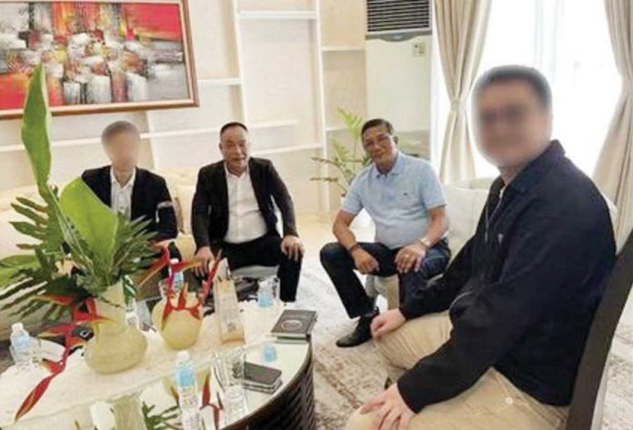 Ex_(1)_resized This undated photo shows former Philippine National Police chief Benjamin Acorda Jr. (third from left) and Chinese businessman Tony Yang (second from left), released by the office of Sen. Risa Hontiveros during a Senate inquiry on Sept. 24.