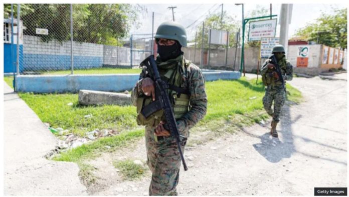 Haiti_copy_resized Haitian soldiers stand guard at the entrance to Port-au-Prince international airport after armed gang members exchanged gunfire with police and soldiers around the airport. GETTY IMAGES