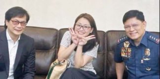 Department of Interior and Local Government secretary Benhur Abalos (left) and Philippine National Police chief Rommel Marbil (right) are pictured with a candid-looking arrested fugitive Alice Guo in Indonesia. NBI PHOTO