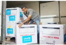 Israel agrees to pauses in fighting for polio vaccine drive A worker unloads a shipment of polio vaccines at a depot belonging to Gaza's health ministry. The World Health Organization is aiming to achieve 90% vaccine coverage across the strip, which is needed to stop transmission of the virus within Gaza. AFP