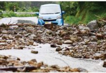 One dead and several missing after Japan rains A road is covered with stones due to landslides caused by a torrential rain, in Wajima, Ishikawa Prefecture, Japan. REUTERS