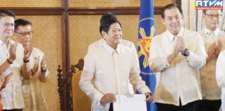 President Ferdinand R. Marcos Jr. holds the Magna Carta of Filipino Seafarers that he signed into law, honoring the sacrifices of overseas seafarers and their significant contributions to economic growth. He emphasizes the importance of the new law which aims to uphold the fundamental rights of seafarers. PCO