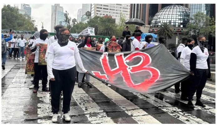 Mexico_resized Protesters in Mexico City carrying a banner commemorating the 43 missing student teachers