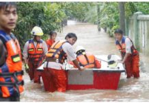 100 dead in Myanmar floods after Typhoon Yagi Rescue volunteers with a boat wade through a flooded road in Taungoo, Myanmar, on September 12, 2024, amid heavy rains triggered by Typhoon Yagi. EPA