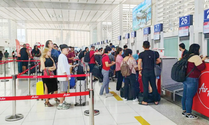NAIA_changes New NAIA Infrastructure Corp. proposes that the Ninoy Aquino International Airport terminal 2 will only service domestic flights. Photo shows passengers checking in for their flights at terminal 2. AIRASIA PHILIPPINES PHOTO