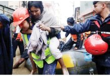 Floods and landslides kill at least 100 in Nepal A police personnel carries an injured woman from an inflatable raft after being rescued from a flooded area near the bank of the overflowing Bagmati River in Kathmandu, Nepal. REUTERS