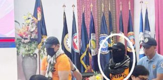 Pastor Apollo Quiboloy is unrecognizable as he wears shades, mask, a black scarf and a hat bearing the word “Agila” when he is presented during a press conference in Camp Crame on Monday, a day after he was taken into custody. Quiboloy was presented by Interior Secretary Benjamin Abalos Jr. PHILIPPINE DAILY INQUIRER