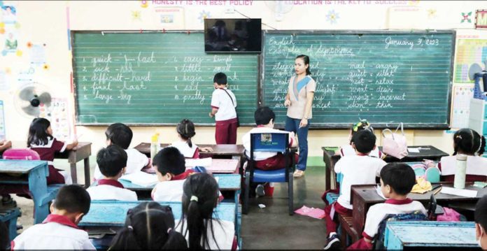 Public_school_1_resized A public school teacher and her students during a classroom exercise. INQUIRER FILES