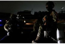South America drought brings blackouts Two people in military fatigues sit in the bed of a truck in a street enveloped in darkness in Ecuador due to a blackout. REUTERS