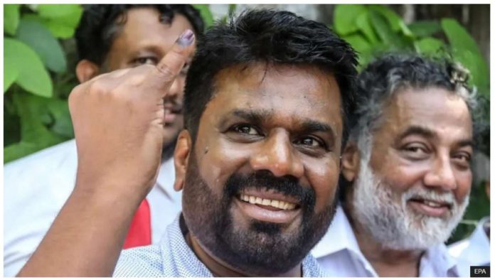 Sri_Lanka_resized Anura Kumara Dissanayake, presidential candidate and leader of the opposition party National People's Power (NPP), shows his ink-marked finger after casting his vote during the presidential election, in Colombo, Sri Lanka, on September 21, 2024. EPA