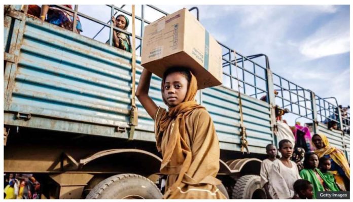 Sudan_1_resized A Sudanese girl who have fled the war with her family carries a box of belongings after arriving at a transit center for refugees in Renk in South Sudan. GETTY IMAGES
