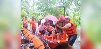 Personnel of the Bacolod City Disaster Risk Reduction and Management Office, Philippine Coast Guard and Philippine Army rescued residents from flood waters in Barangay Pahanocoy on Saturday, Sept. 14, 2024. BACOLOD CDRRMO PHOTO