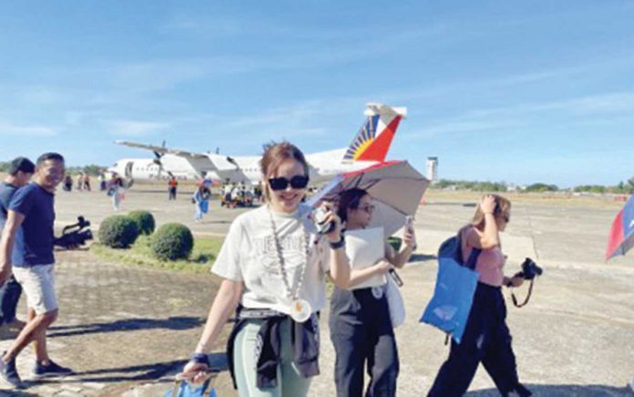 VAT_refund_(1)_resized Tourists arrive at the Laoag International Airport in this undated photo. The Department of Tourism says providing incentives such as value-added tax refunds to foreign travelers would make the Philippines “competitive” as a destination among its peers in Southeast Asia. PNA FILE PHOTO BY LEILANIE ADRIANO