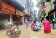 Over 150 dead in Vietnam as typhoon floods capital People wade through a flooded street following the impact of Typhoon Yagi, in Hanoi, Vietnam. Residents have been using boats to navigate their neighborhoods as flood waters reached a meter high. REUTERS