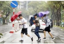 Super typhoon Yagi kills four in Vietnam People hold umbrellas as they cross a street under the rain in Hanoi, Vietnam. EPA