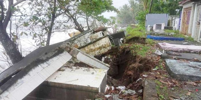antique_habagat_1_resized Tombs at Aguila Public Cemetery in Sebaste, Antique where visibly sinking due to the strong impact of waves on Saturday, Sept. 14, 2024. CHRISTINE MAE ANTONIO VIA DISCOVER ANTIQUE, PHILIPPINES PHOTO