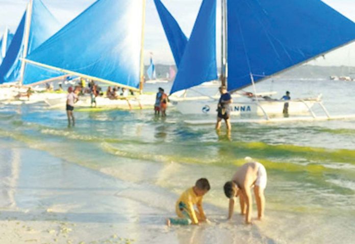 boracay-tourists The drop in the number of foreign tourists visiting Boracay Island is attributed to the decrease of Chinese tourist arrivals and limited regional flights to Kalibo International Airport and Caticlan Airport from South Korea and Taiwan.