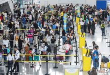 Cheaper plane tickets await passengers in October Outbound travelers queue at the Ninoy Aquino International Airport Terminal 3 check-in and immigration counters. MARIA TAN/ABS-CBN NEWS PHOTO