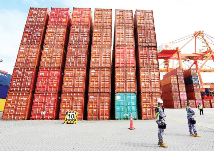 importers_1_resized Photo shows containers of sacks of rice at the Port Area Manila on Sept. 19, 2024. MIKE ALQUINTO/THE MANILA TIMES PHOTO
