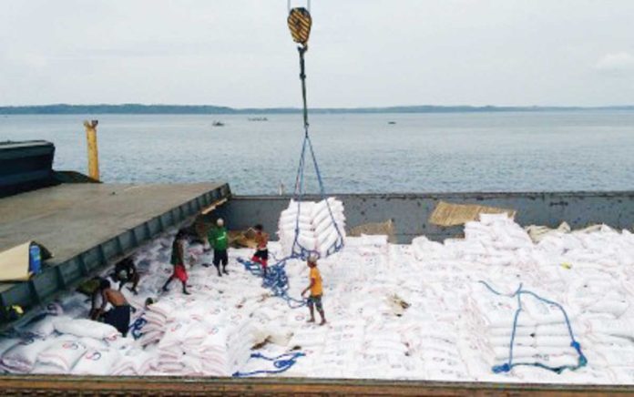 port_congestion_resized Sacks of rice from Thailand are loaded on a cargo ship docked at the Tabaco Port in Albay. NFA ALBAY FILE PHOTO