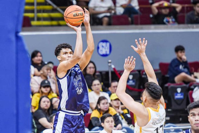 sports-Fransman-1 Adamson University Falcons’ Anthony Fransman shoots over the defense of University of Santo Tomas Growling Tigers’ Miguel Pangilinan. UAAP PHOTO