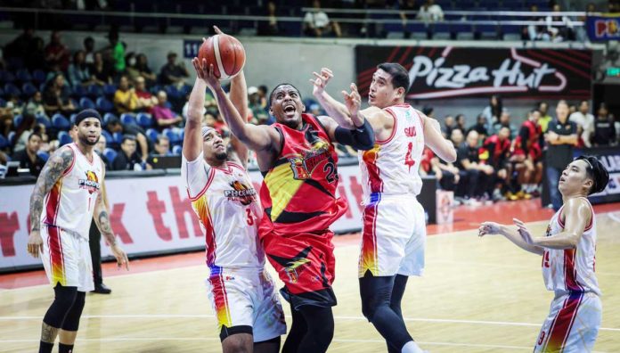 San Miguel Beermen’s Jordan Adams tries to score against the defense of Negrense Raul Soyud and Jason Perkins of Phoenix Fuel Masters. PBA PHOTO