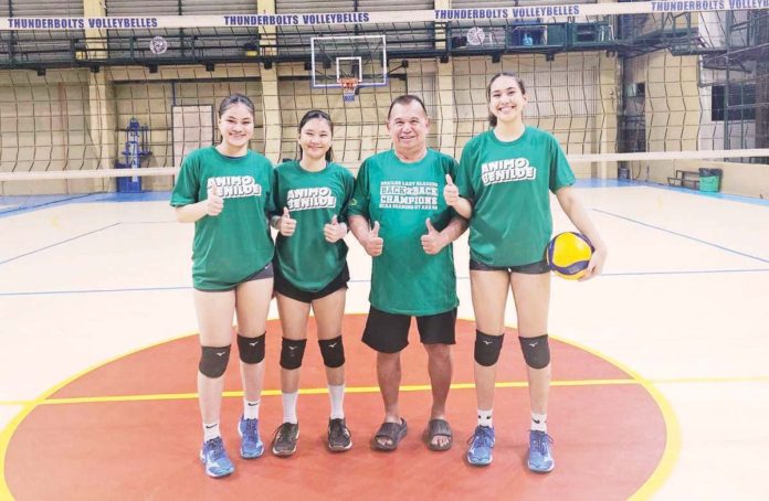 sports_3_resized Joenil Anne Ramos, Rhea Tomas, and Camila Amor Bartolome are pictured with Bacolod Tay Tung High School Thunderbolts’ team manager Jose Montalbo. PHOTO COURTESY OF JOSE MONTALBO