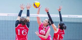 Negrense Erika Jin Deloria of Biñan Tatak Gel 1-Pacman Partylist Volley Angels smashes the ball against two defenders. MPVA PHOTO