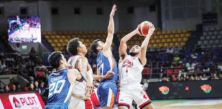 Barangay Ginebra San Miguel Kings’ Rhon Jhay Abarrientos attempts to score against the defense of Ilonggo Anjo Caram of Meralco Bolts. PBA PHOTO