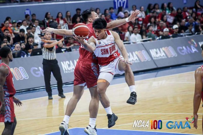 sports_Ilonggo_resized Ilonggo John Bryan Sajonia of San Beda University Red Lions goes for a tough basket against a Lyceum of the Philippines Pirates defender. PHOTO COURTESY OF NCAA/GMA SPORTS