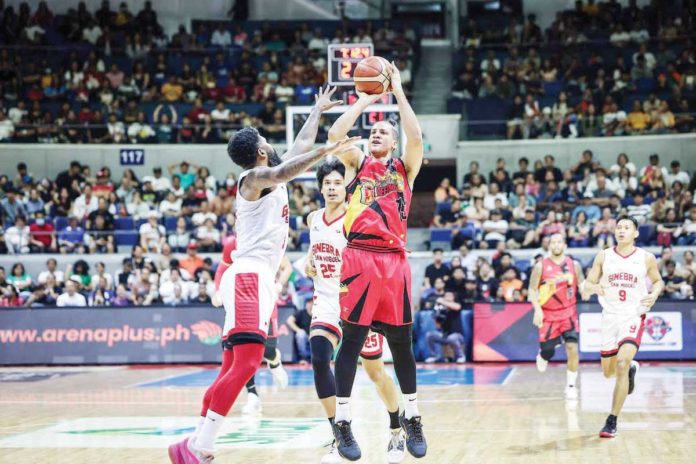 sports_Lassiter_resized San Miguel Beermen’s Marcio Lassiter shoots over the defense of Barangay Ginebra San Miguel Kings’ Maverick Ahanmisi. PBA PHOTO
