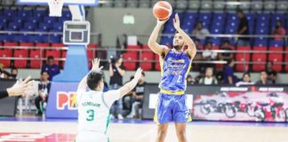 Magnolia Chicken Timplados Hotshots’ Jerrick Ahanmisi shoots over the defense of Terrafirma Dyip’s Juan Miguel Tiongson. PBA PHOTO
