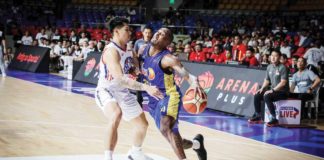 TNT Tropang Giga’s Rondae Hollis-Jefferson tries to protect the ball while being defended by NLEX Road Warriors’ Javee Mocon. PBA PHOTO