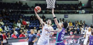 Ilonggo Antonio Jose Caram of Meralco Bolts attacks the defense of Converge FiberXers' Alec Stockton for a layup. PBA PHOTO