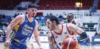 Rain or Shine Elasto Painters’Aaron Fuller tries to score against the defense of Magnolia Chicken Timplados Hotshots’ Ian Sangalang. PBA PHOTO