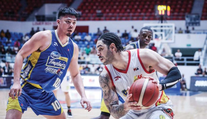 sports_PBA_resized Rain or Shine Elasto Painters’Aaron Fuller tries to score against the defense of Magnolia Chicken Timplados Hotshots’ Ian Sangalang. PBA PHOTO