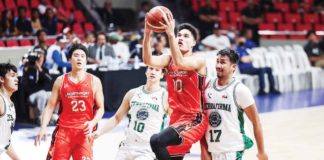 NorthPort Batang Pier’s Arvin Tolentino eludes his Terrafirma Dyip defenders for a layup. PBA PHOTO