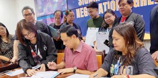 Gov. Arthur Defensor Jr.; Ma. Airis Penetrante, president of the Association of Iloilo Provincial Government Employees; and Atty. Renee Valencia, head of the Provincial Human Resource Management and Development Office, signed the Collective Negotiation Agreement (CNA) incentive of the government employees to be released in December 2024. BALITA HALIN SA KAPITOLYO/FB PHOTO