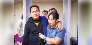 Pastor Apollo Quiboloy of the Kingdom of Jesus Christ is being escorted by a policewoman into the Senate to attend the Committee on Women’s hearing, his first since the body started its investigation in December 2023. PHOTO FROM SENATE PRIB